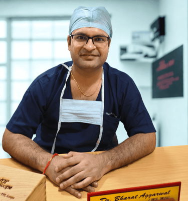 "Dr Bharat Agarwal consulting patient at plastic, reconstructive and cosmetic surgery clinic in Udaipur"
