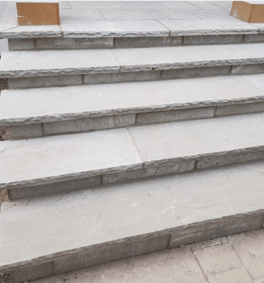 a set of stairs leading up to a patio