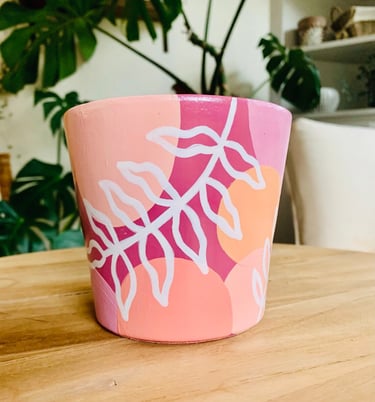 group of women painting a terraccotta plant pot at a hen party workshop in York