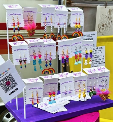 Display of lots of earrings at a market 