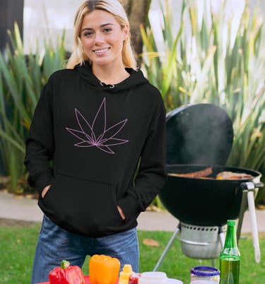 a beautiful woman wearing a black hoodie with a pink cannabis leaf on the front