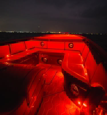 a boat with red lights on it's side