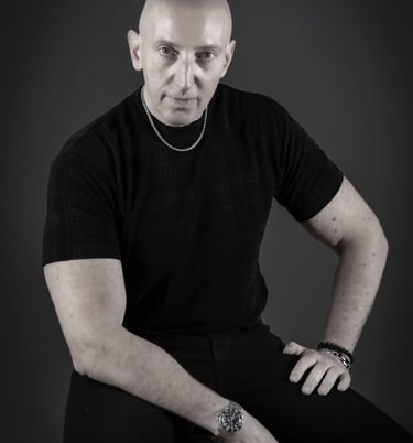 a man in a black shirt and a watch