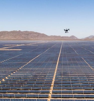 a droneflying over a large array of solar panels