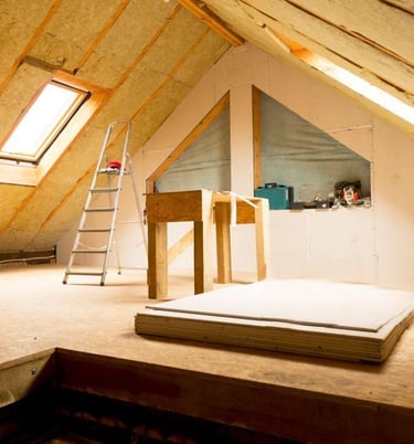 a room with a ladder and a ladder
