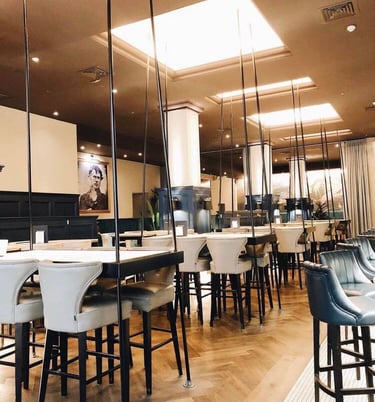 a restaurant with a long table and chairs