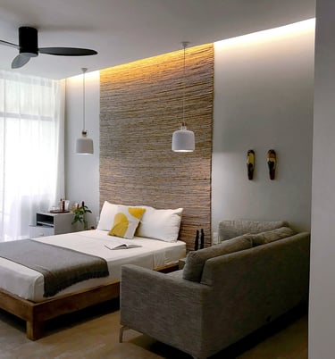 a bedroom with a couch and a bed