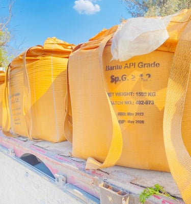 a truck with a large amount of bags of sandbags on the back of it