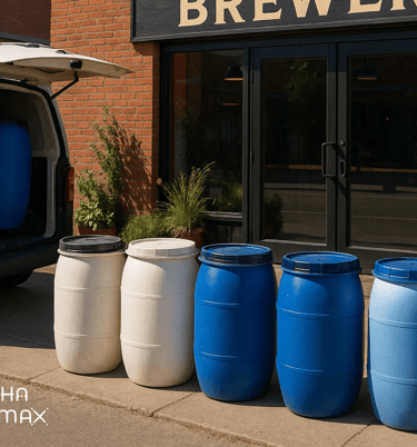 Barrels with used malt being picked up by a ban in front of the entrance of a brewery