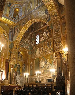 Arabic arches and Byzantine mosaics in the Cappella Palatina of Roger II of Sicily.