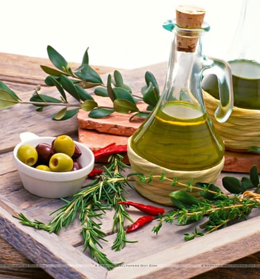 olive oil and olive oil bottles with olive oil and herbs