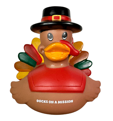 a ducky with a hat on a white background