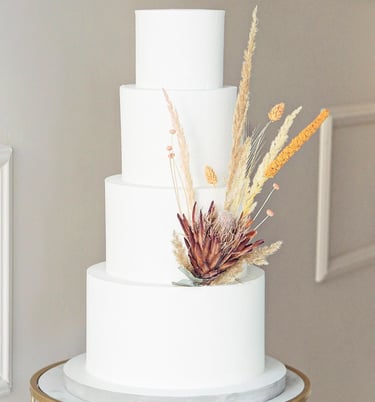 a white cake with a flower on top of it