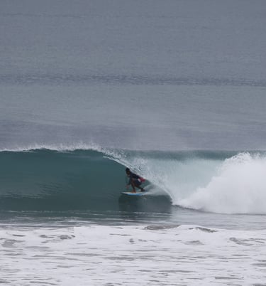 A surfer riding a perfect Ecuadorian tubular wave