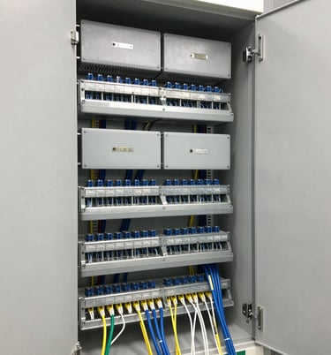 Modern office space showcasing elegant furniture with integrated lighting and network cables.