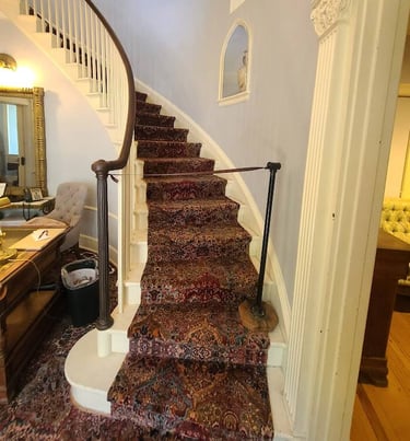 Huntsville, AL - Inside the mansion is a beautiful curved staircase at Burritt on the Mountain