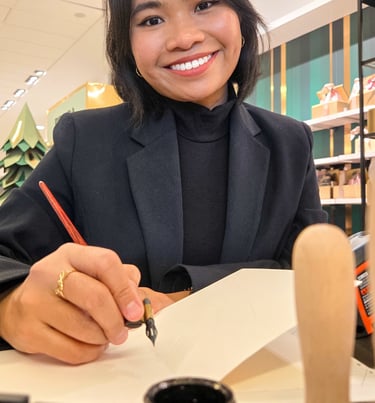 New York City Calligrapher performing live calligraphy on holiday cards with pointed pen