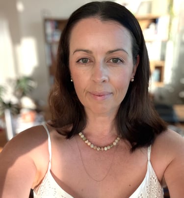 Brisbane-based photographer and content creator in a relaxed natural-light setting