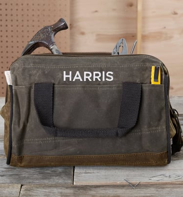 a tool bag with a hammer 
