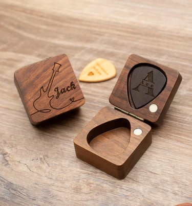 a wooden box with a guitar pickle on it