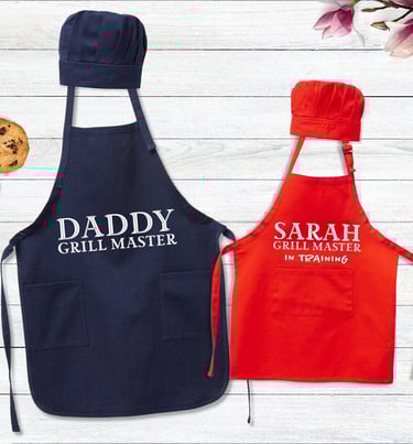 a couple of aprons with a cookie cookie and cookie