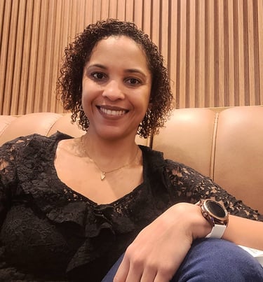 a woman sitting on a couch with a watch on her wrist