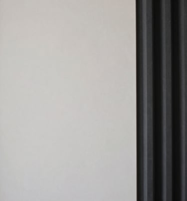 A minimalist architectural detail of a Lagos recording studio, featuring clean lines and a palette of #0A0A0A and #F5F5EB.