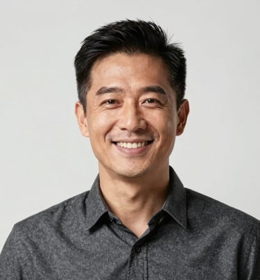 A sharp, centered portrait of a man in a ghost white background, professional and charismatic smile, charcoal gray shirt, high-end photography for personal branding.
