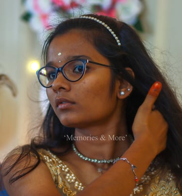 a young girl in a gold dress and glasses