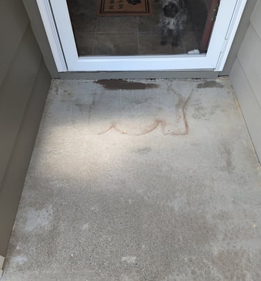 Concrete front door stoop with Joy outline