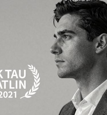 B&W profile of a male model looking into the distance, sharp lighting, Charcoal Grey and Off-white palette.