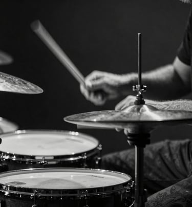 A black and white detail shot of a drummer's hands striking a cymbal. Motion blur adds to the raw energy and emotion. Dark, minimalist aesthetic, captured in a Western European / Dutch studio.