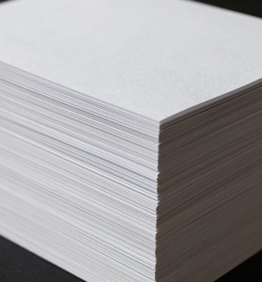A minimalist photo of a stack of clean white paper, soft shadows, representing the elegance of print photography, International / Western.
