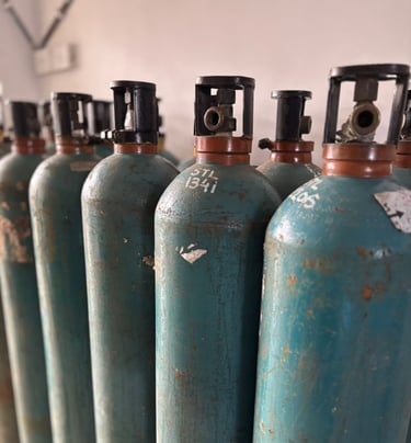 a row of gas bottles with a lot of gas