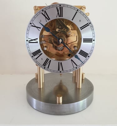 Restored Mantel clock, mounted to give full visiblity to the movement.