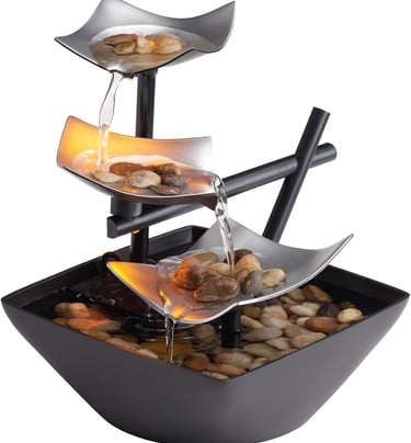 Indoor tabletop water fountain with cascading water, natural river rocks and LED lights for calming home or office decor