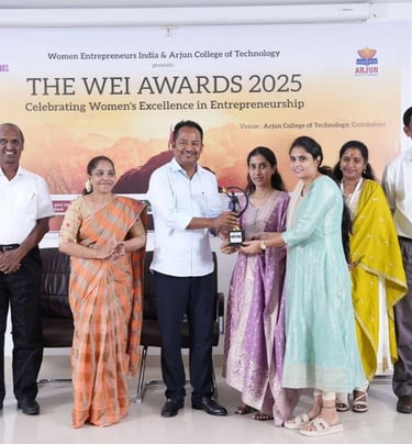 a group of people standing around a table with a man in a white shirt