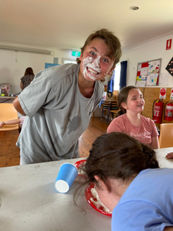 Teenage boy with cream on his face