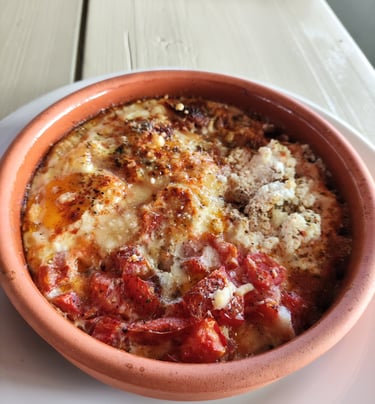 Eggs with sausage & cheese in the oven , at Sunset Drift tavern in Ksamil