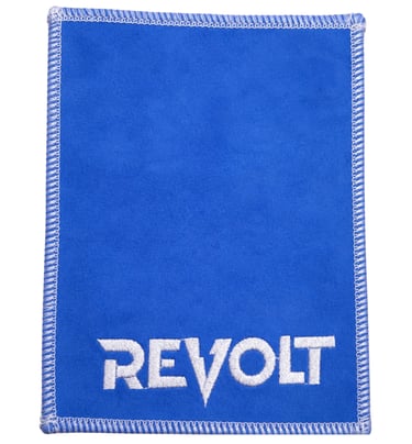 Revolt brand blue leather cleaning cloth with white embroidered logo and stitched edges.