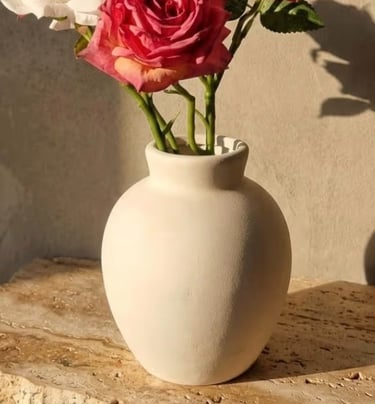 Round beige ceramic bud vase