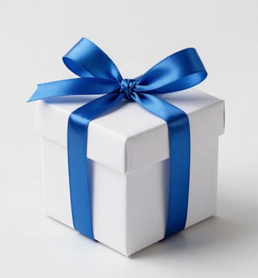 Close-up of delicate wedding favor boxes tied with sky blue twine on ivory linen.