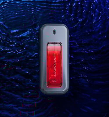 Bottle of perfume laying flat in water