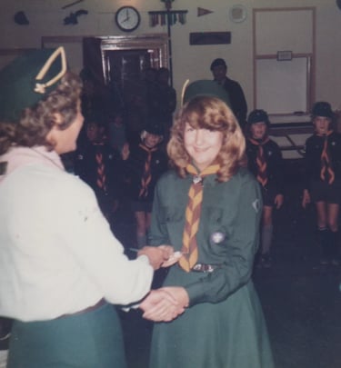 cub and scouts leaders in a hut