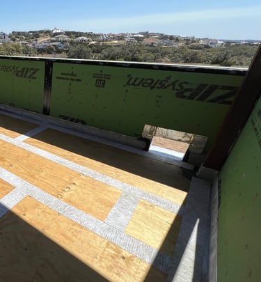 Waterproofing plywood joints before apply membrane and concrete on custom home balcony.