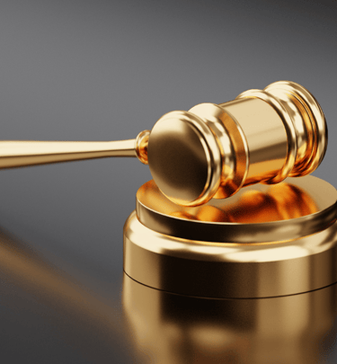 a golden gavel with a gavel and a gavel