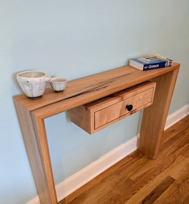 Pecan and black epoxy waterfall entry or console table with floating undermount drawer