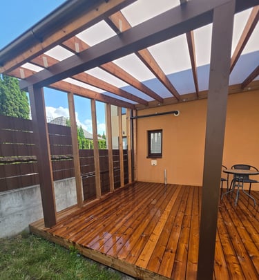 a wooden deck with a table and chairs