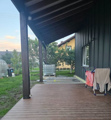 a porch with a blanket on the porch