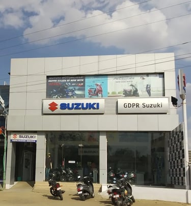 a group of motorcycles parked in front of a building